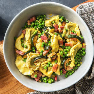 Lemony Cheese Tortelloni with Pancetta, Peas, and Zucchini