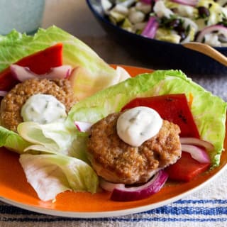 Lettuce-wrapped turkey sliders with basil mayo and black bean salad