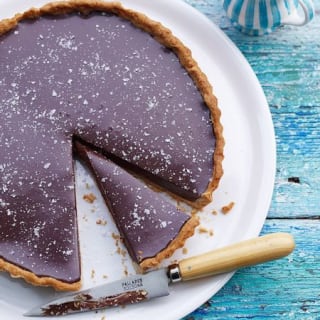 Rich chocolate tart with salt flakes