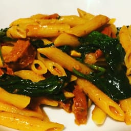 Chorizo, spinach and tomato pasta with red pesto.