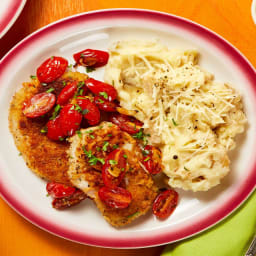 Crispy Pork Milanese with Cheesy Potatoes and Blistered Tomatoes