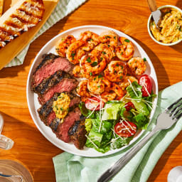 Herb-Grilled Steak & Old Bay Shrimp with Caesar Salad & Garlic Bread