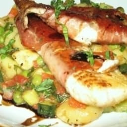 Prosciutto Wrapped Tilapia served over Gnocchi with Spring Vegetables 