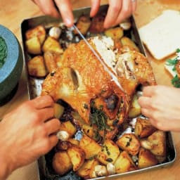 Roast chicken with lemon and rosemary roast potatoes