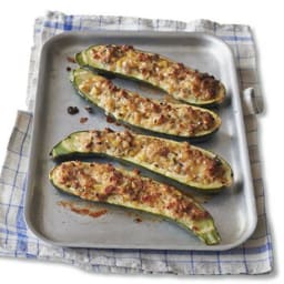 Sausage and herb stuffed courgettes