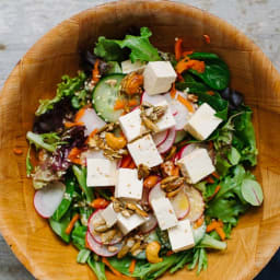 Spinach, Tofu, and Shaved Carrot Salad with Sesame Dressing and Spiced Pepi