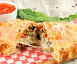 Calzone-with-Broccoli,-Red-Peppers,-and-Mushroomswith-marinara-dipping-sauc