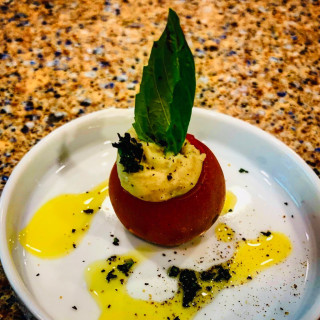 Amuse Bouche cherry tomato cups filled with white bean hummus 