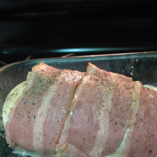 Bacon wrapped, cheese stuffed chicken