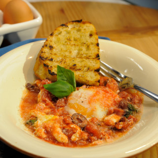 Baked Eggs with Salami, Mozzarella, Olives and Garlic Bread