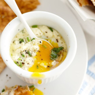 Baked eggs with wilted kale and feta with dukkah pita crisps