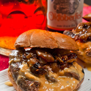 Bratwurst sandwich with beer braised onions and beer cheese sauce