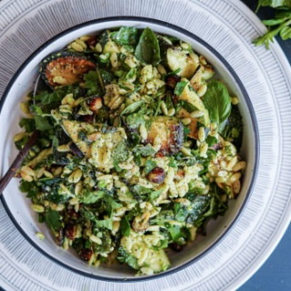 Charred zucchini, risoni and herb salad with parmesan and pea dressing