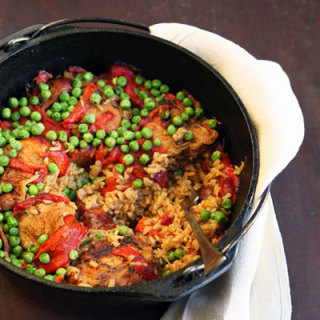 Chicken With Roasted Red Pepper, Chorizo And Sweet Pea Sauce Over Rice