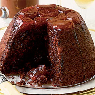 Chocolate and apricot pud with glossy chocolate sauce