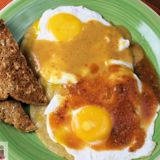 Divorced eggs (Fried eggs in arbol and chipotle sauce)