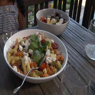 Fusilli pasta with grilled cherry tomatoes and fresh basil