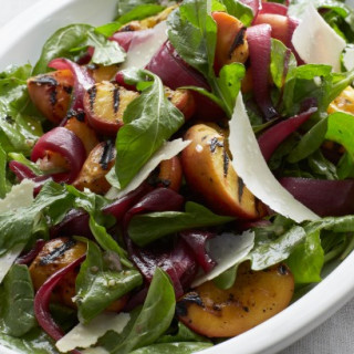 Grilled peaches with pickled onions, rocket, and parmagiano cheese