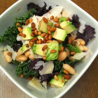 Kale salad with Parmesan, avocado, cannellini beans and pine nuts