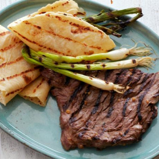 Korean-Style Marinated Skirt Steak with Grilled Scallions and Warm Tortilla