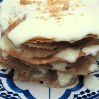 Ktefa - Crispy Moroccan Pastry Layered with Custard Sauce and Almonds
