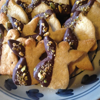 Lemon-cardamom cookies dipped in chocolate w/pistachio & salt sprinkles.
