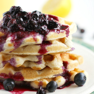 Light and Fluffy Vegan Waffles with Blueberry Sauce.