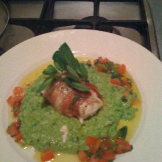 Monkfish rapped in Parma Ham served with pea & mint puree