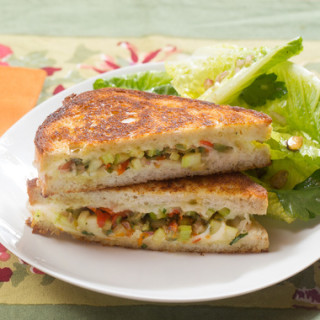 Muffuletta-Style Grilled Cheese Sandwicheswith Baby Romaine and Pistachio S