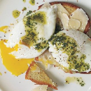 Poached Eggs and Parmesan Cheese Over Toasted Brioche with Pistou