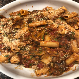 Rigatoni with smokey mushrooms peppers and spinach.