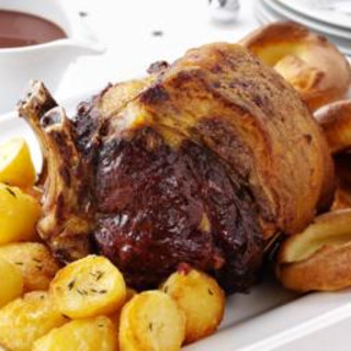 Roast beef with Yorkshire puddings, roast potatoes and gravy