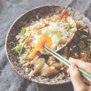 Stir-fried lettuce bowl with ginger fried rice and fried egg