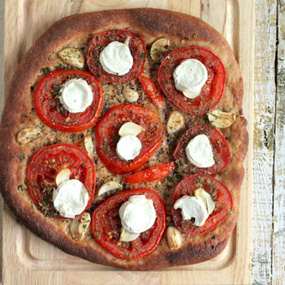 Tomato Garlic Coconut Mozzarella on 100% Whole Wheat crust Pizza. vegan rec
