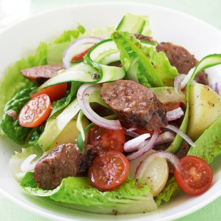 Warm sausage salad with pepper dressing