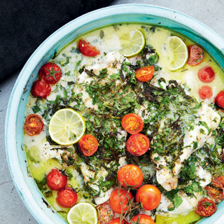 White fish with herbs, coconut milk, lime, and tomatoes