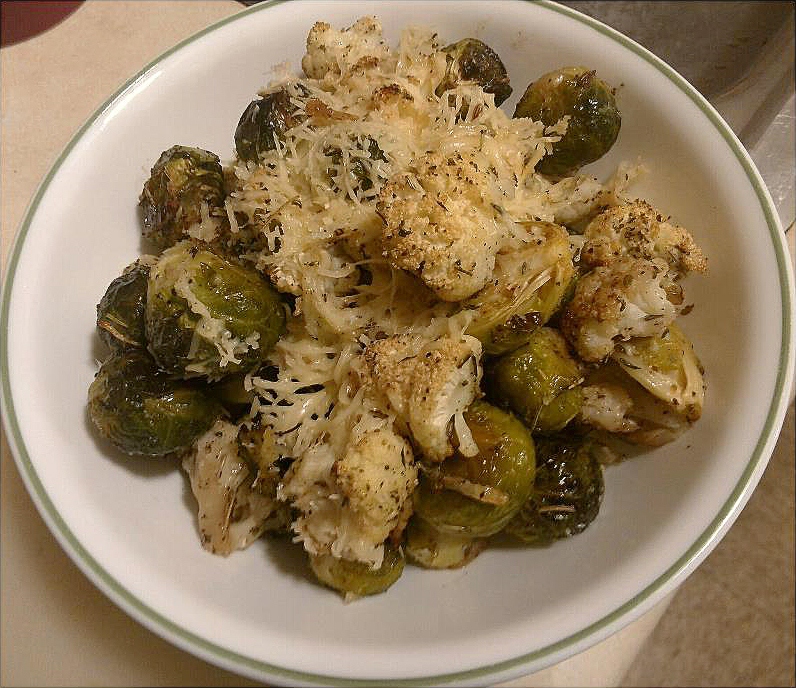 Oven Roasted Brussel Sprouts And Cauliflower Drizzled With Parmesan