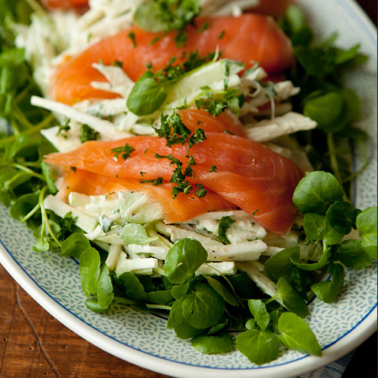 Apple celeriac remoulade on watercress topped with salmon