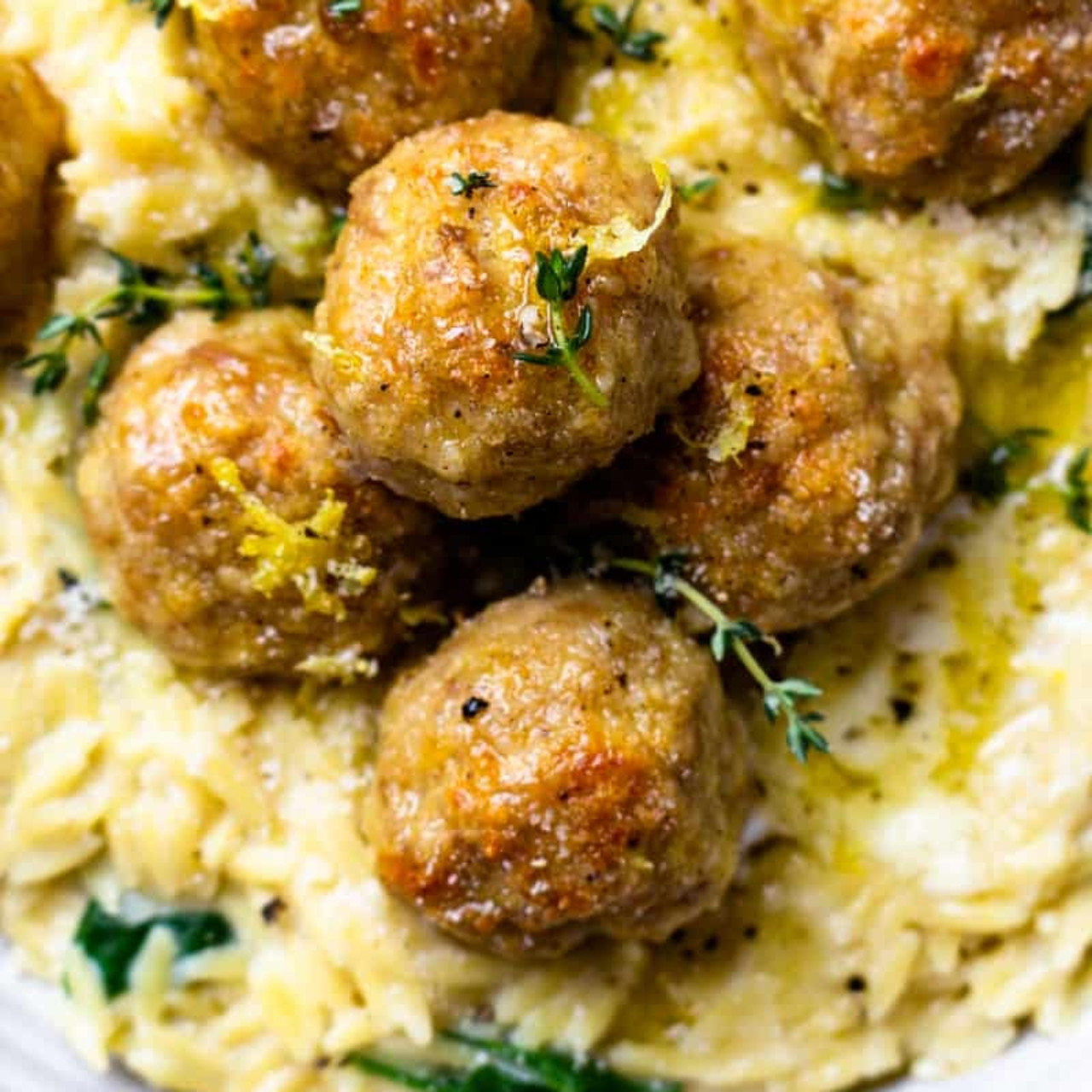 BAKED LEMON BUTTER CHICKEN MEATBALLS WITH CREAMY SPINACH ORZO