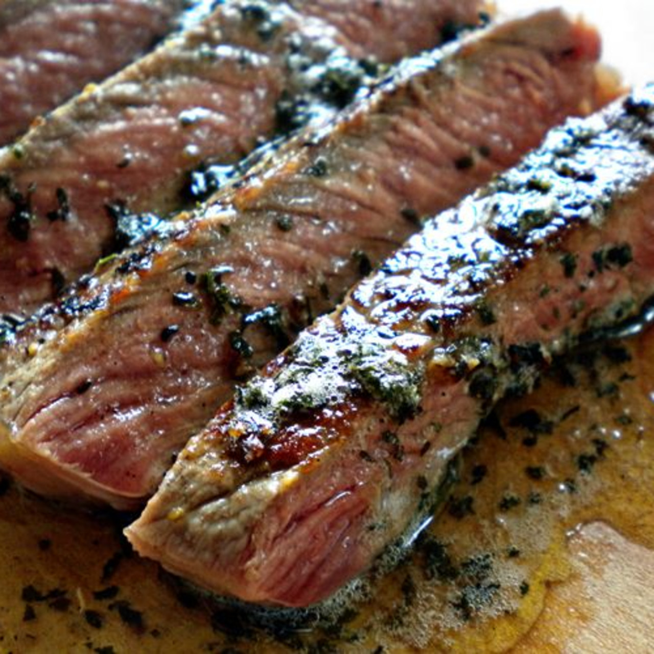 https://bigoven-res.cloudinary.com/image/upload/t_recipe-1280/cast-iron-steaks-with-herb-but-8b677d.jpg