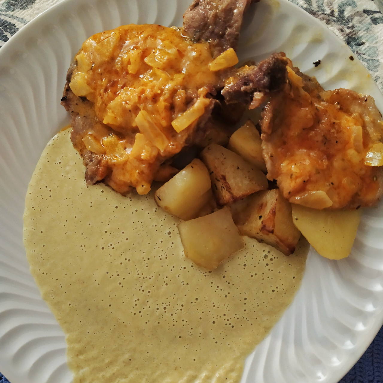 Cheesy pork chops with meltinyour mouth potatoes and green bean sauce.