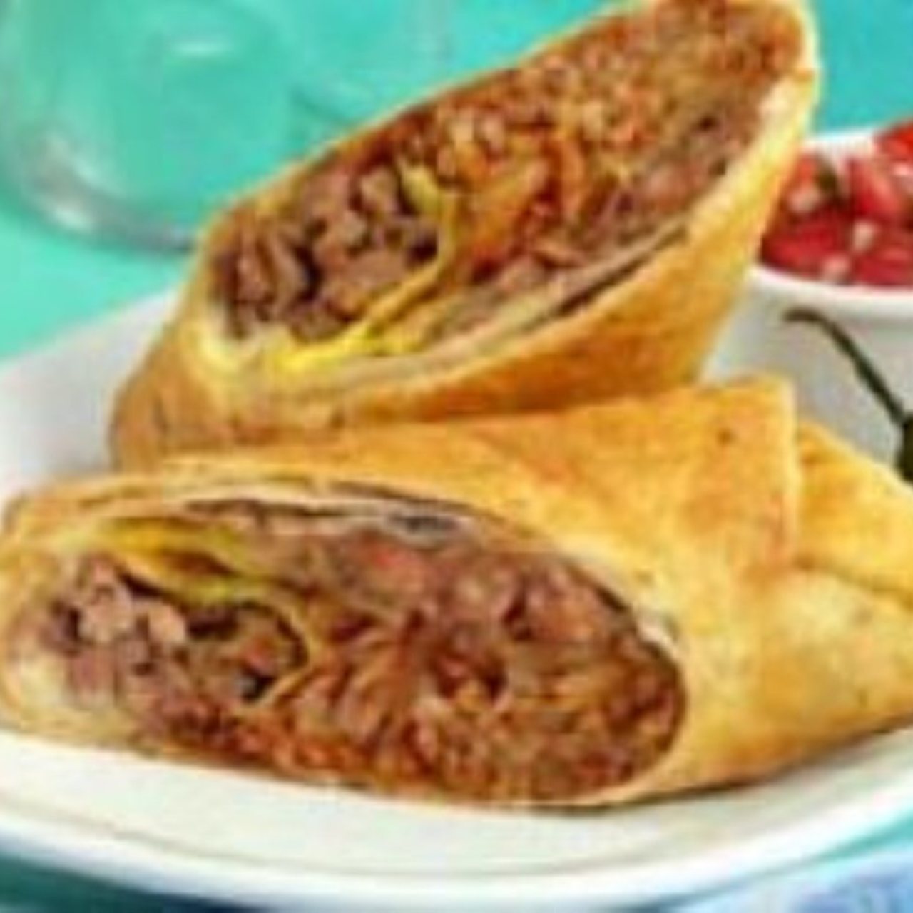 Chimichanga, Chimichanga is a deep-fried burrito that is po…