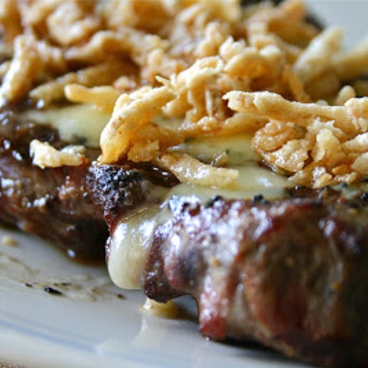 Garlic Rubbed Steak with Blue Cheese and French Fried Onions