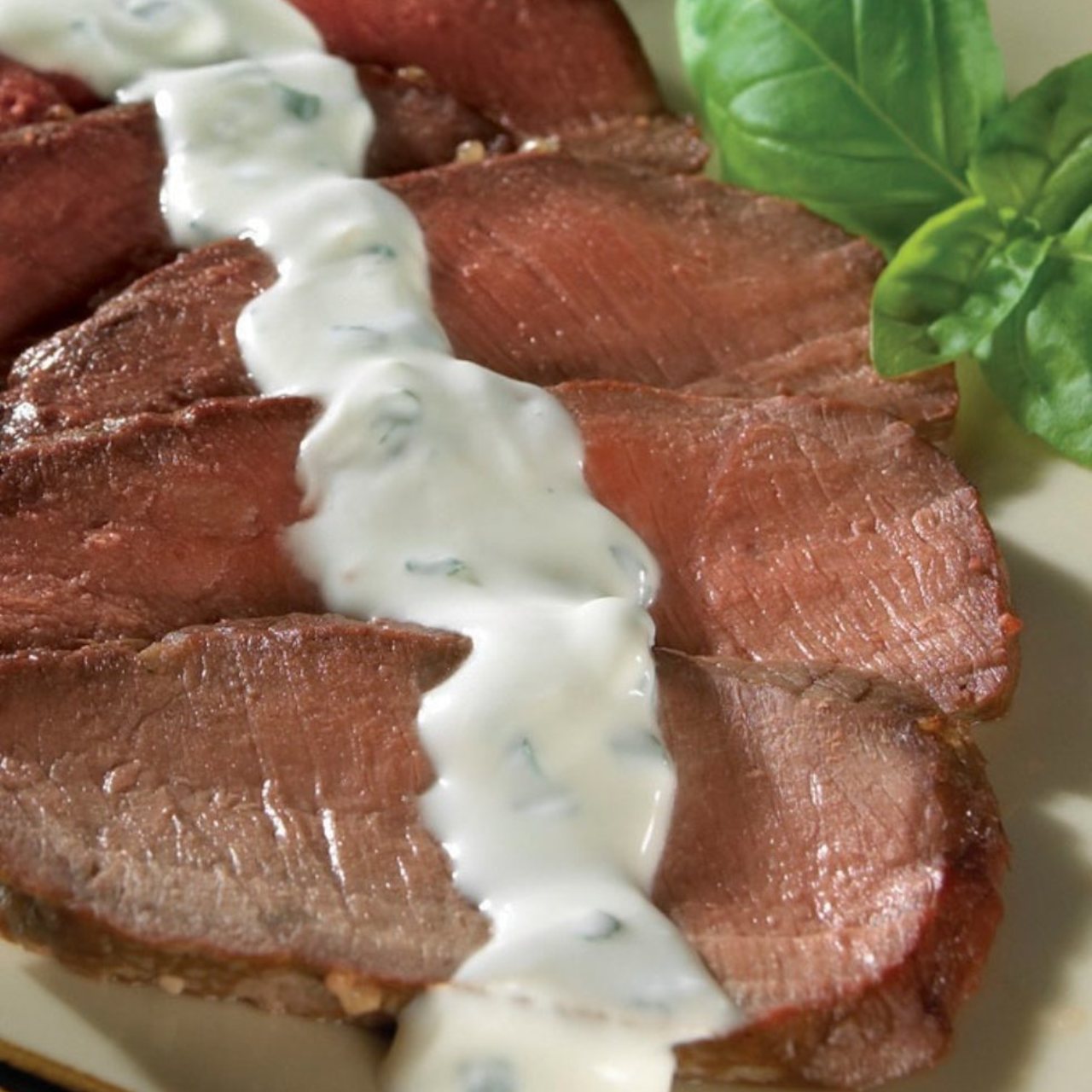 Grilled Steak with Creamy Herbed Goat Cheese Sauce