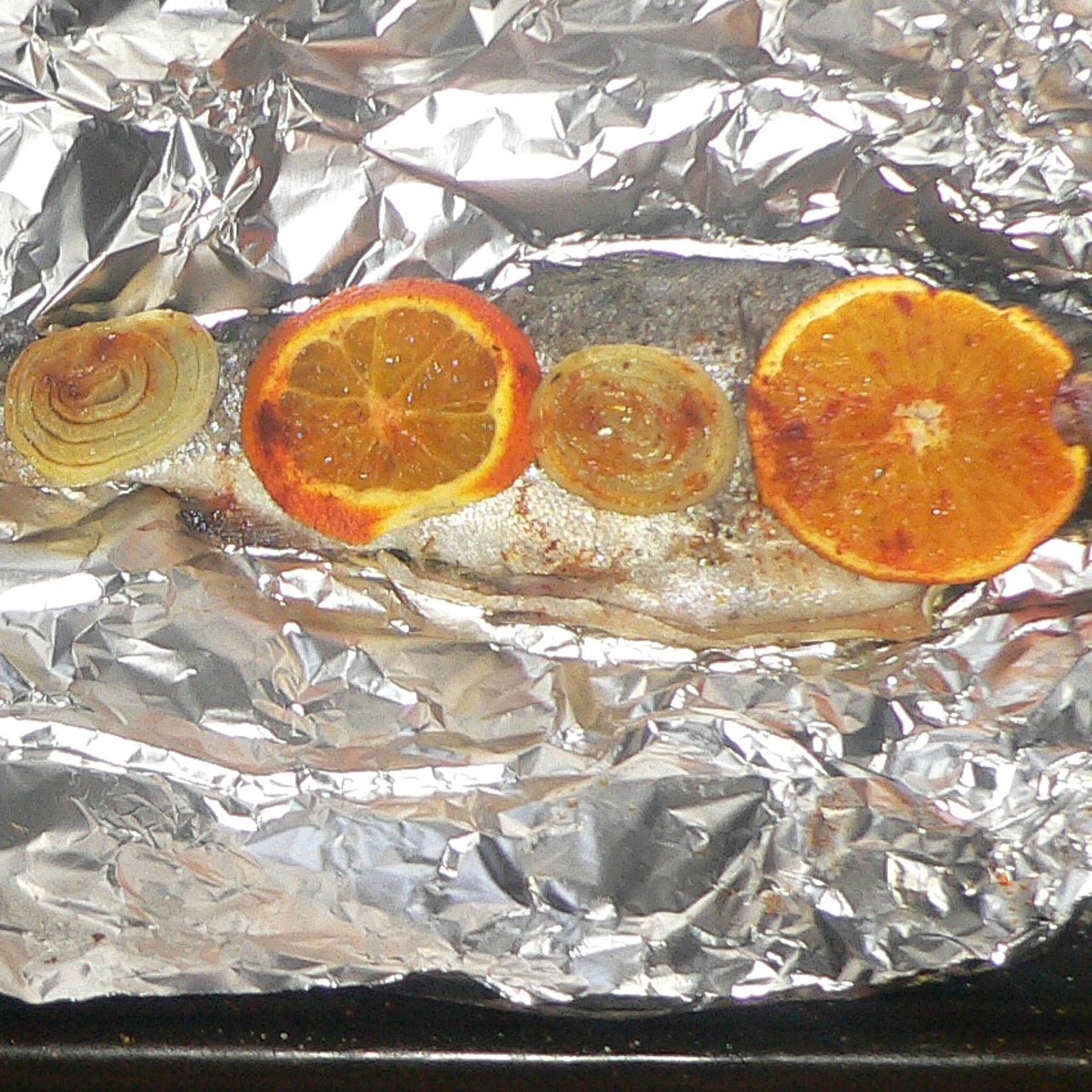 Herb Stuffed Trout with Orange And Onions Reduced