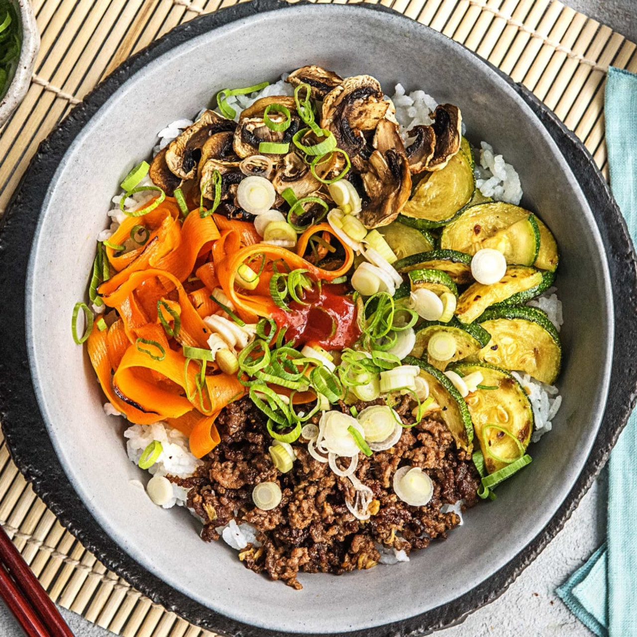 Korean beef Bibimbap with Zucchini, Mushrooms, and Carrot