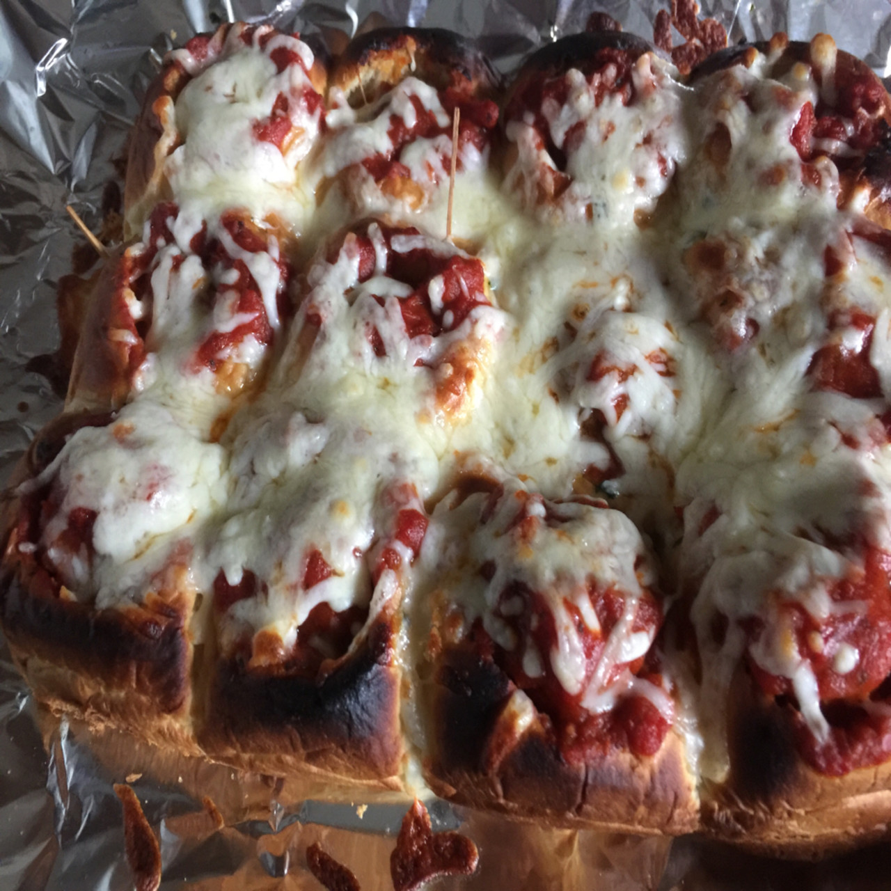 Meatball stuffed cheesy garlic bread