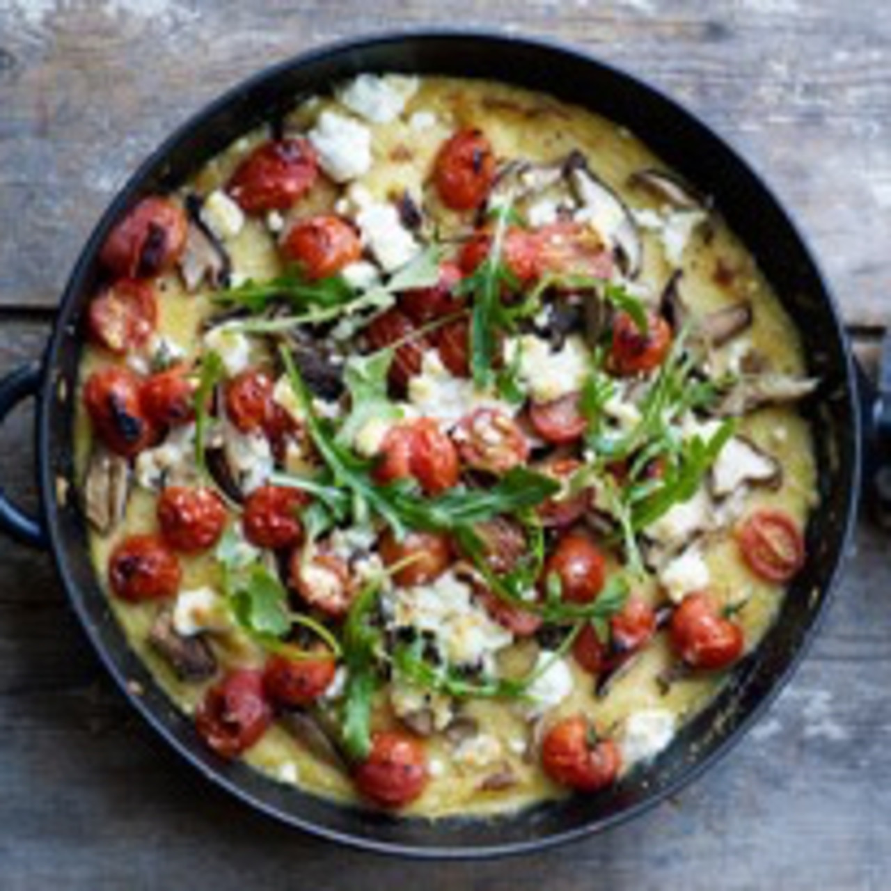 Polenta bake with tomato, feta, and mushrooms