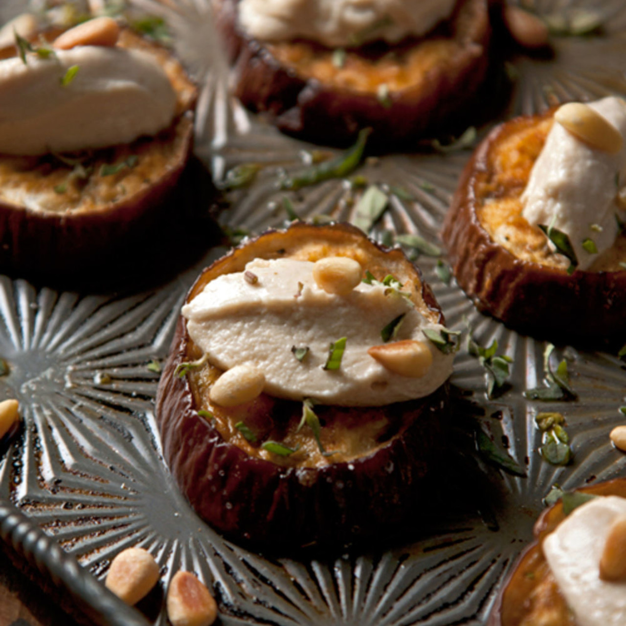 Roasted Eggplant with Goat cheese, tahini and pine nuts