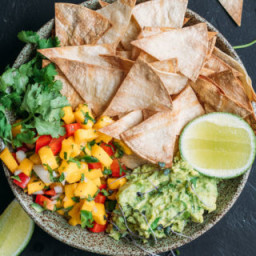 Baked corn chips with guacamole and mango salsa